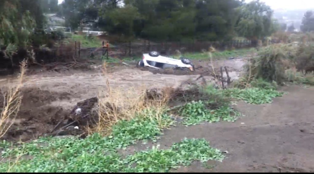 Overturned car in flooded river in Santa Clarita, California, March 2018.