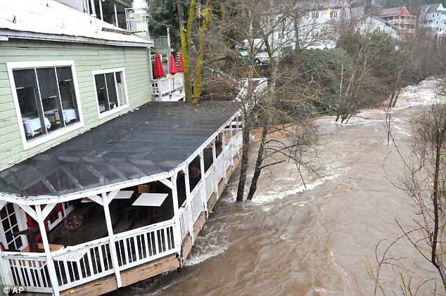 Click to enlarge Floodwater can be seen gathering around the lower deck of this building in Nevada City