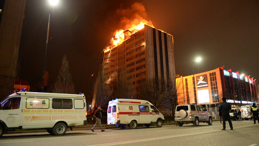 Click to enlarge Fire engulfs roof of high-rise in Russia's Chechnya