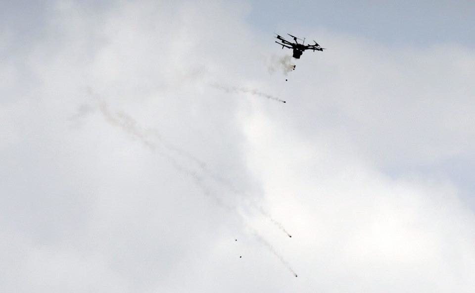 Click to enlarge gaza tear gas drone protest