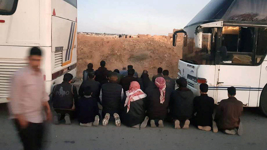 Click to enlarge Rebels pray before they are evacuated from the town of Douma, eastern Ghouta