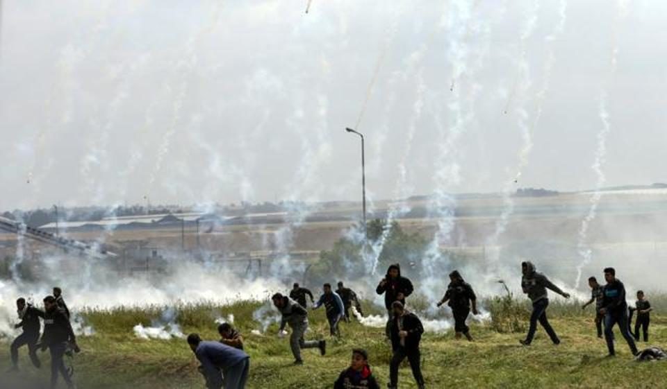Land Day protests, israel tear gas Gaza protesters