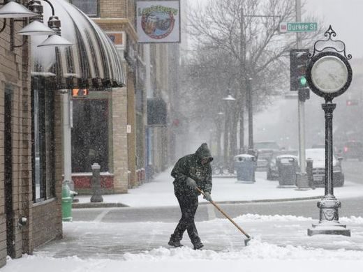 Click to enlarge Ken Fritsch showels heavy snow in front of Avenue Jewelers along College Avenue Tuesday, April 3, 2018, in Appleton, Wis.