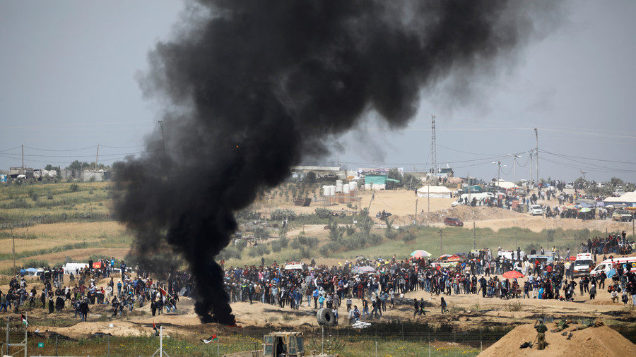 Click to enlarge Israeli soldiers are seen next to the border fence on the Israeli side of the Israel-Gaza border