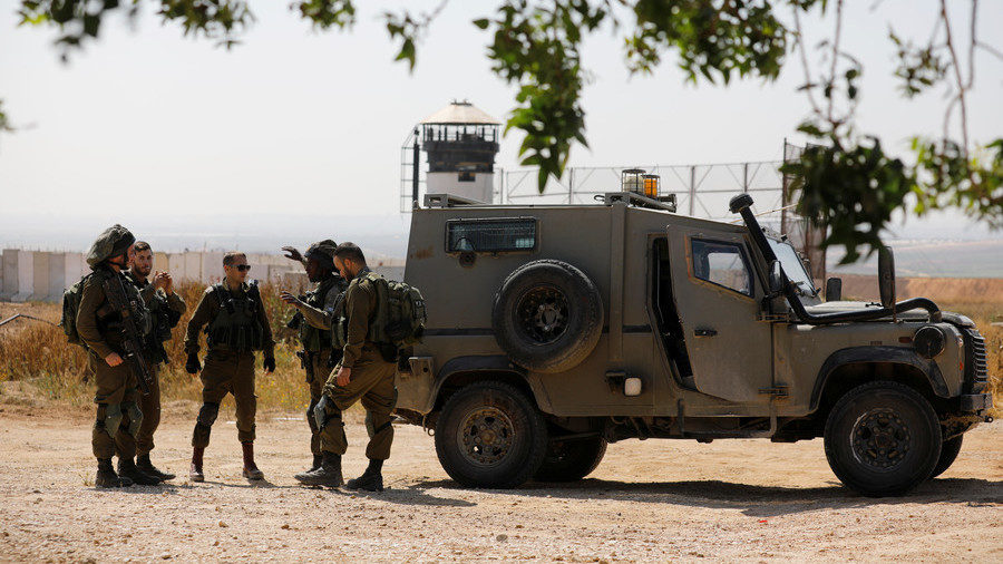 Click to enlarge Israeli soldiers deploy on the Israeli side of the border with the northern Gaza Strip.