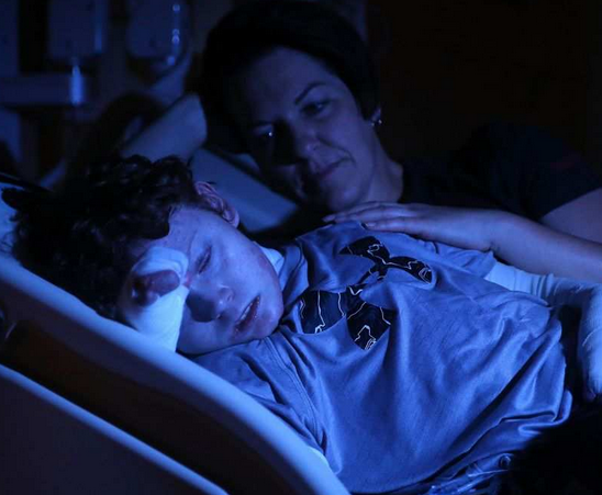 Jonathan Pitre and his mother, Tina Boileau, in hospital in Minneapolis.
