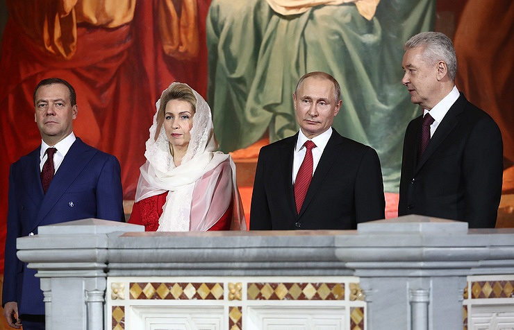 Russian President Vladimir Putin and Prime Minister Dmitry Medvedev with his wife Svetlana Medvedev