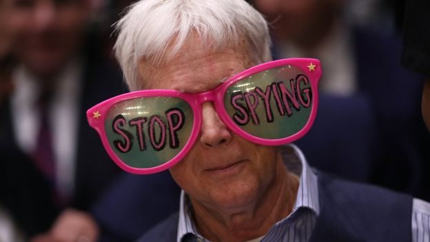 Click to enlarge protester Cambridge Analytica Facebook