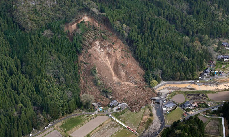 An early morning mudslide April 11 sent tons of rocks, trees and dirt tumbling down a mountainside in the Yabakei district of Nakatsu, Oita Prefecture.