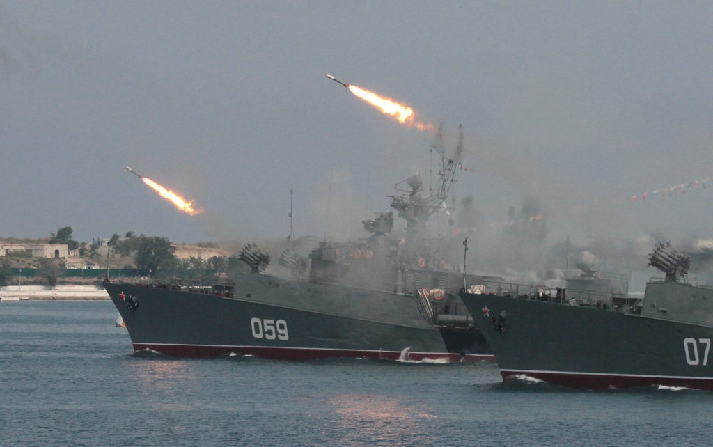 Russian navy ships fire off missiles at a parade