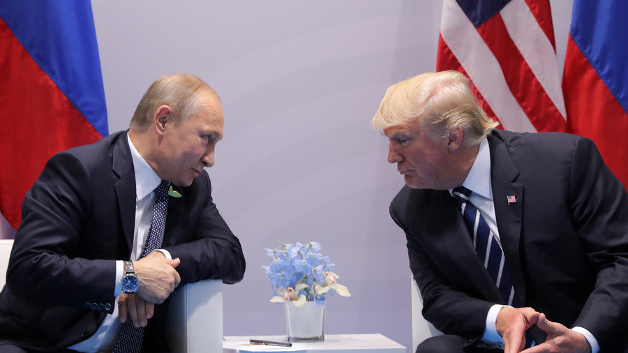 Russia's President Vladimir Putin talks to U.S. President Donald Trump