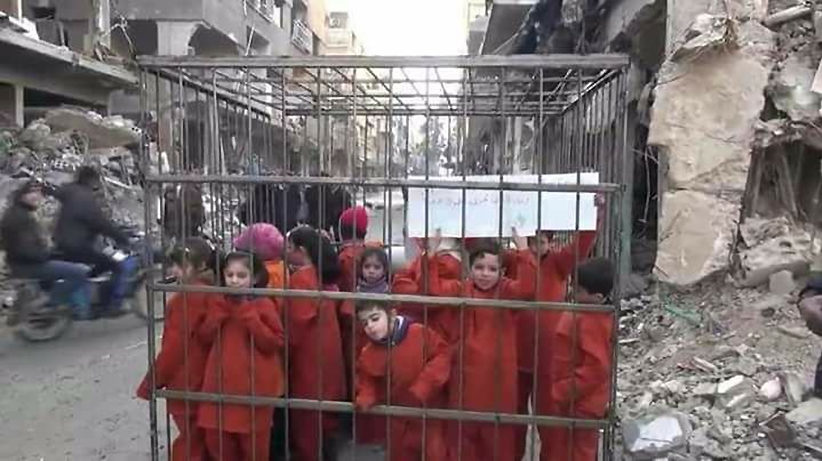 civilians in cages Jaish al Islam Ghouta