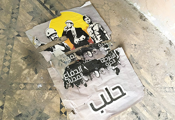 Click to enlarge Propaganda poster for the UK-funded White Helmets, the Free Syrian Police and Aleppo Councils