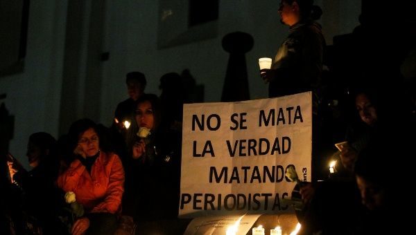 Click to enlarge vigil for two Ecuadorean journalists