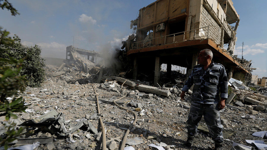 Click to enlarge Syrian firefighter is seen inside the destroyed Scientific Research Centre in Damascus, Syria,