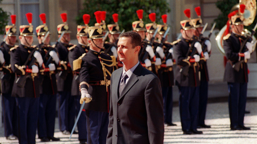 Syrian President Bashar al-Assad arrives for a meeting with then French President Jacques Chirac in Paris, June 25, 2001