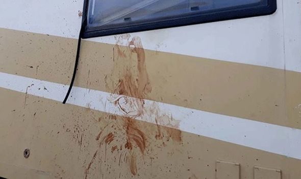 Blood splatters are seen on the couple's camper van