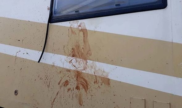 Click to enlarge Blood splatters are seen on the couple's camper van