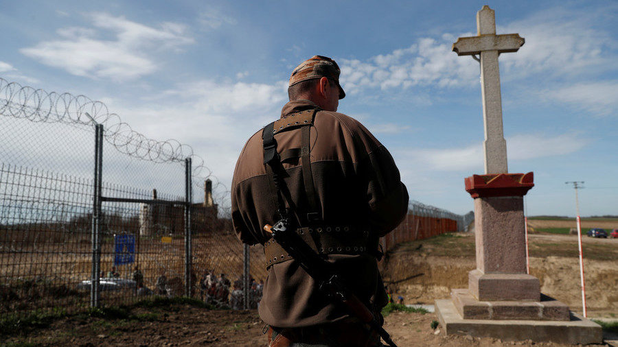 A Hungarian soldier stands at the Hungarian-Serbian border on April 3, 2018.
