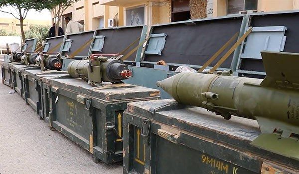 Click to enlarge The Syrian Army men discovered a large cache of weapons and ammunition