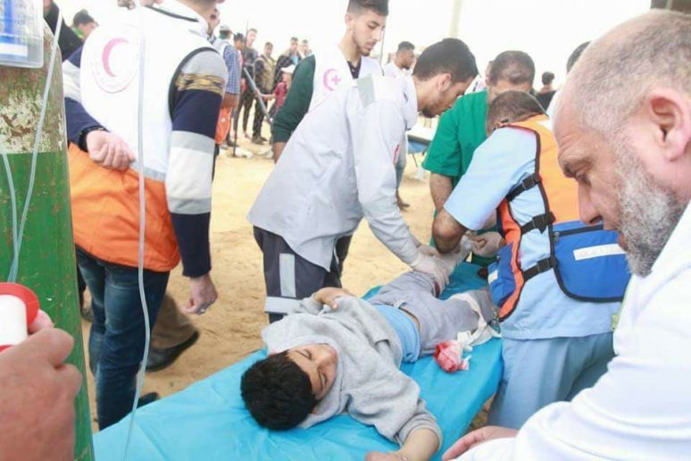 Click to enlarge Wounded Palestinian boy