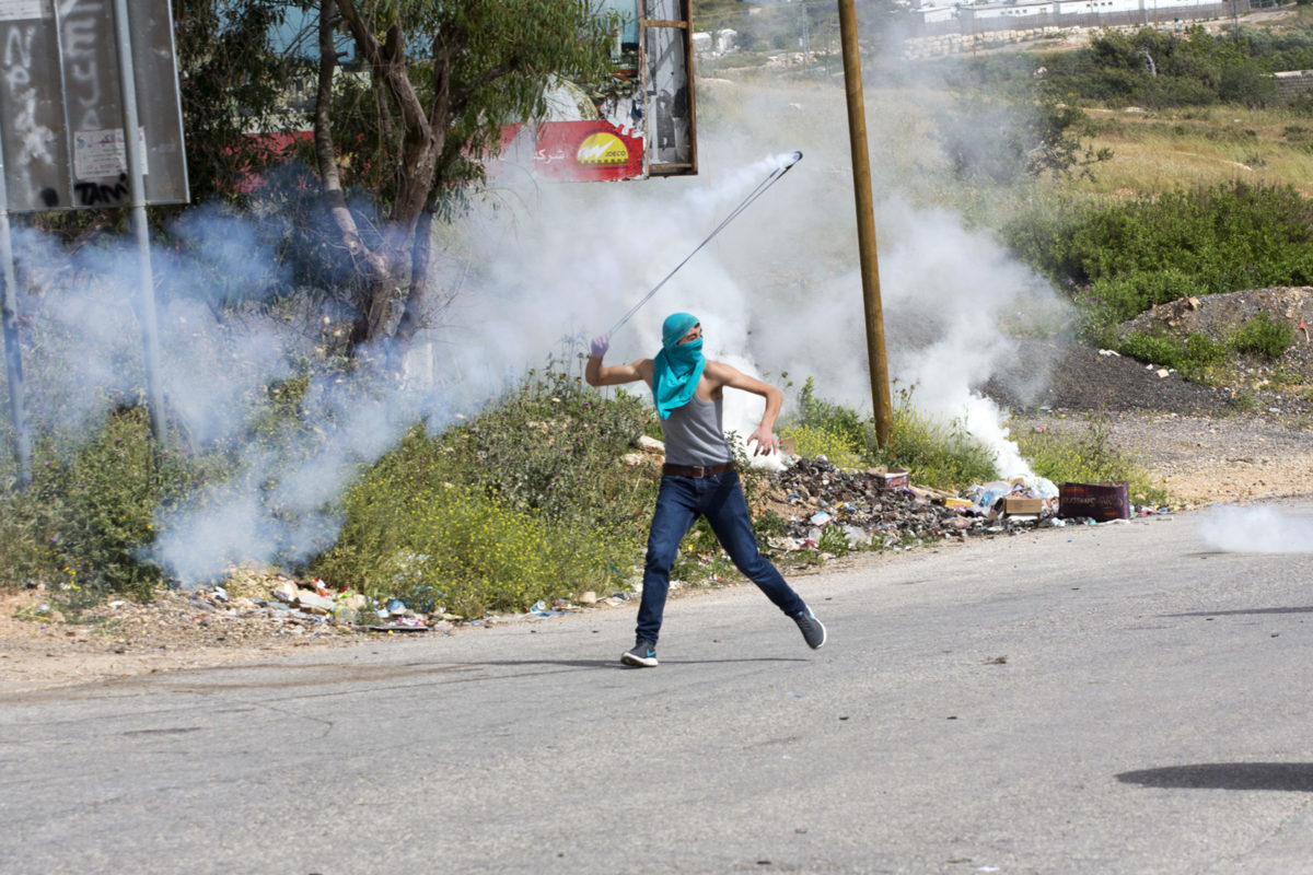 west bank protest slingshot tear gas