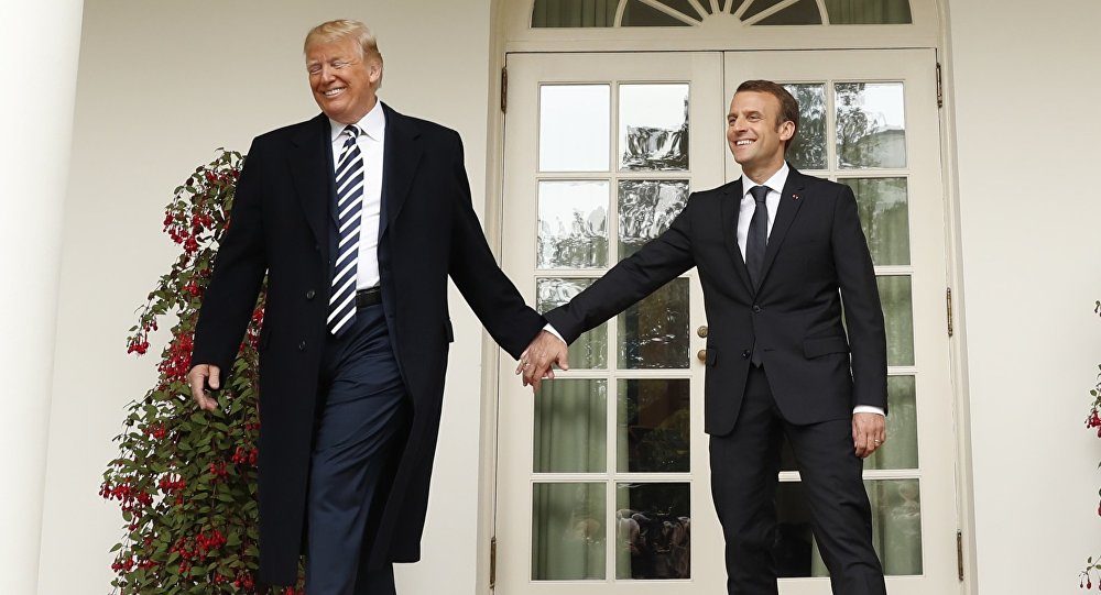 Macron Trump hold hands