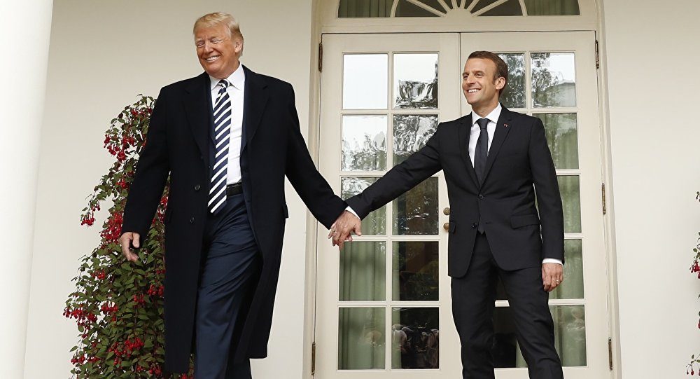 Click to enlarge Macron Trump hold hands