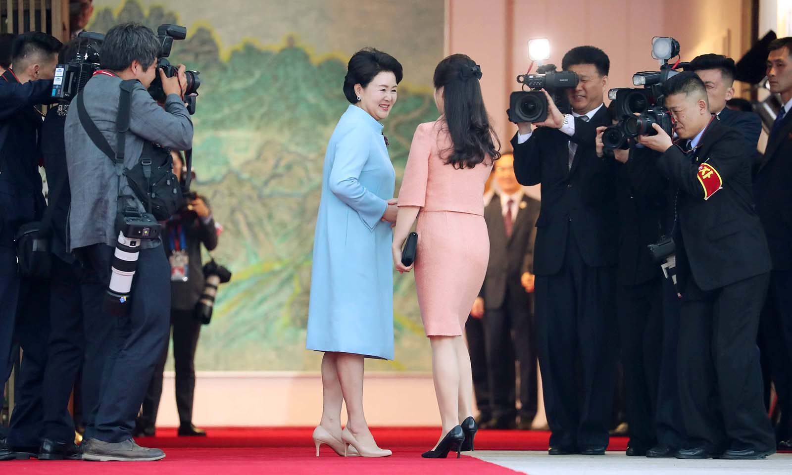 President Moon Jae-in’s wife Kim Jung-sook (left) and North Korean leader K...