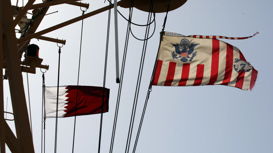 Qatari and a US Coast Guard flags