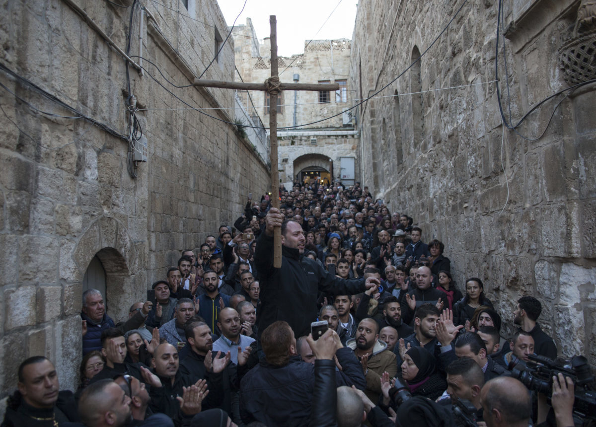 Click to enlarge Palestinian Christians and Muslims march together to the Church of the Holy Sepulchre