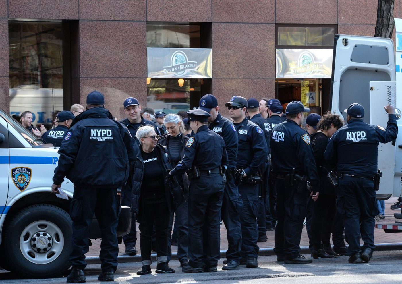 Click to enlarge A member of the group Jewish Voices for Peace was arrested as the group held an impromptu protest outside of Sen. Schumer’s Midtown office on Thursday.