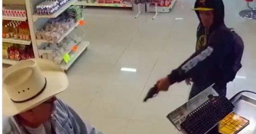 Cowboy eyes robber pointing gun at him, slowly takes off his glasses and gets to work! (VIDEO)