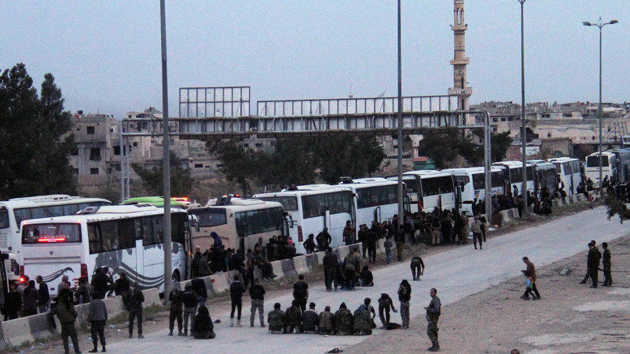 Buses transport militants and their families from Eastern Ghouta