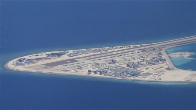 Click to enlarge Chinese structures and an airstrip on the man-made Subi Reef of the Spratly group of islands in the South China Sea