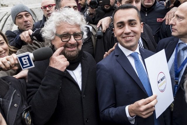 Click to enlarge Beppe Grillo (L) and Luigi Di Maio.