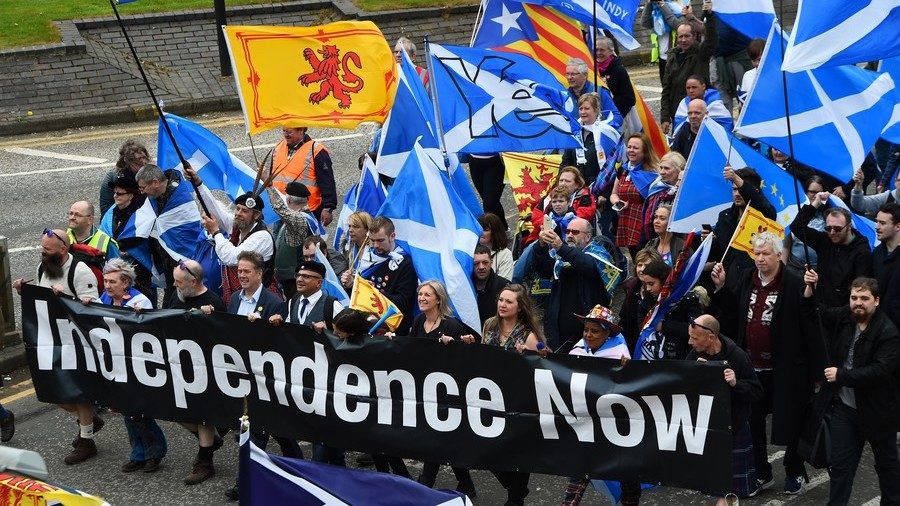 Demonstrators march in support of Scottish independence through the streets of Glasgow