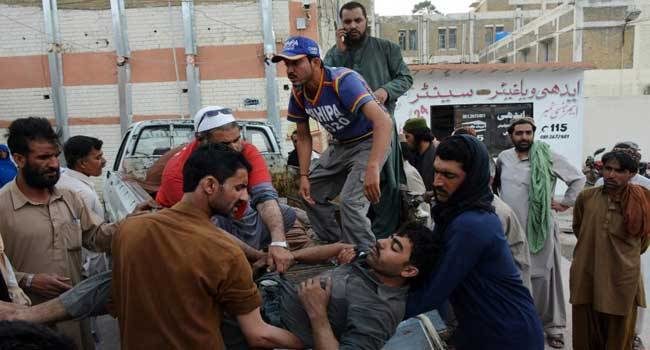 Click to enlarge Pakistani miners shift an injured colleague on a stretcher to carry him to the hospital after the collapse of coal mine in Quetta on May 5, 2018.