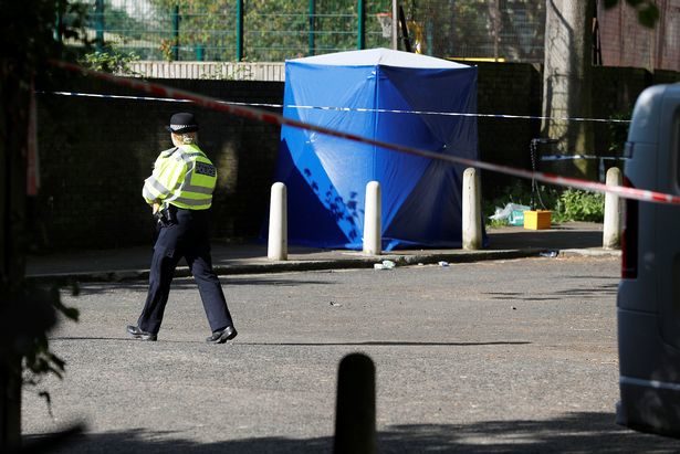 Police are pictured at the scene on Warham Street, where Rhyhiem was discovered with a gunshot injury