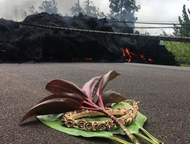 Click to enlarge Image by Ben Gutierrez: Ho'okupu left on a street in the Leilani Estates subdivision include ti leaf and lei.