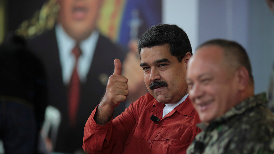 Nicolas Maduro sitting together with Diosdado Cabello