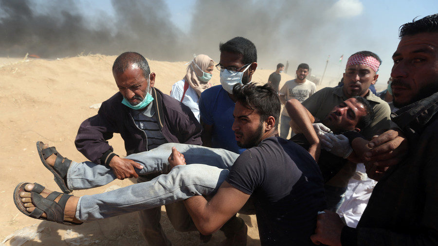 Click to enlarge A wounded Palestinian demonstrato