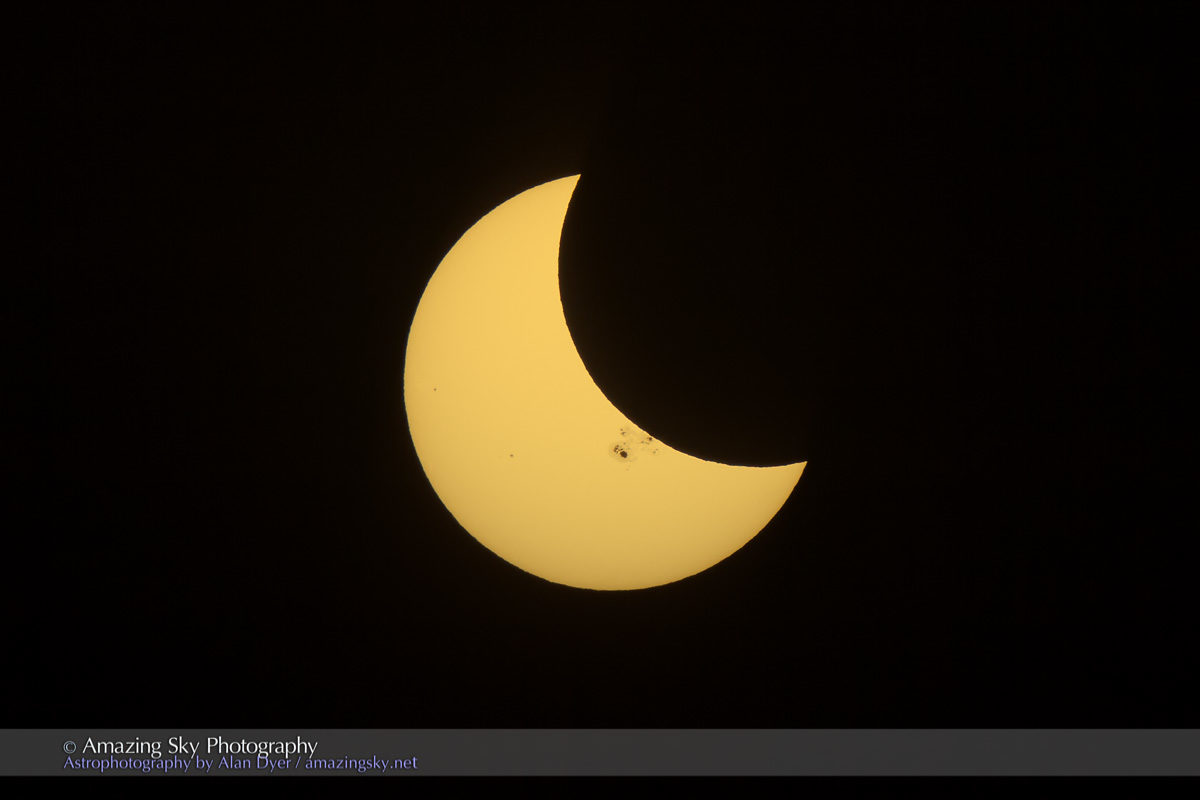 Click to enlarge eclipse sun spot