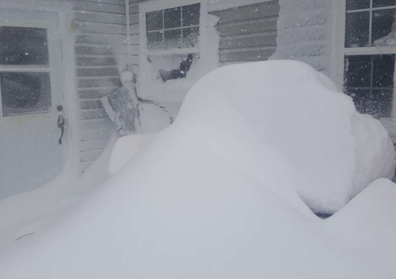 Drifting snow is piled high on CBC producer David Newell's deck in Gander