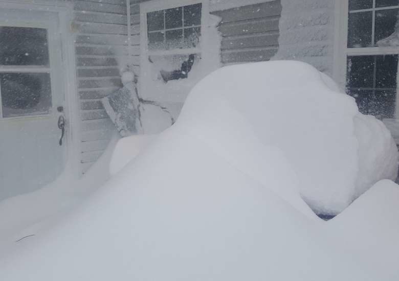 Click to enlarge Drifting snow is piled high on CBC producer David Newell's deck in Gander