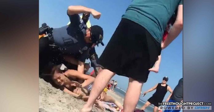 New Jersey cop beats woman in head