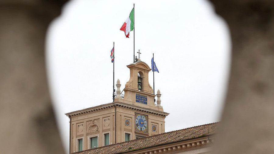 The Italian and EU flags fly at the Quirinal Palace in Rome