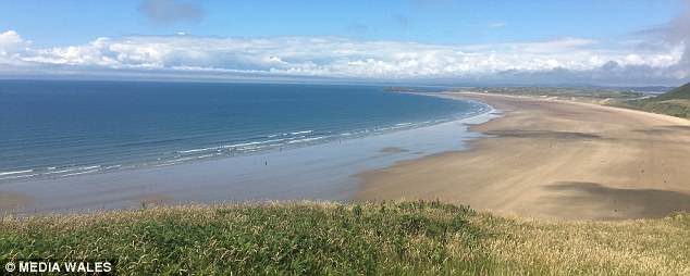 Click to enlarge The beautiful beach at Rhossili was voted the best in Europe by Suitcase magazine last year