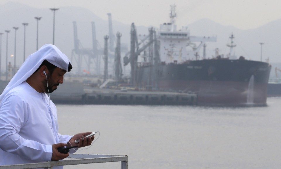 A man stands at an oil terminal at Fujairah, in the United Arab Emirates