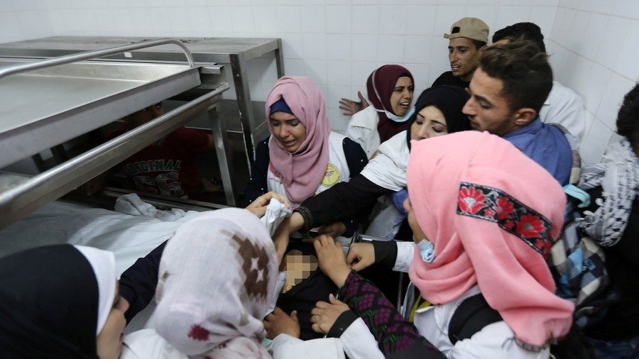 Click to enlarge Colleagues of Palestinian nurse Razan Al-Najar react to her death.